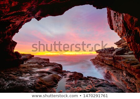 Stock foto: Coastal Cave Views To Glorious Sunrise Over The Ocean