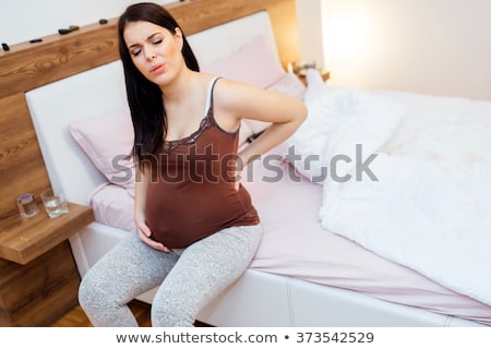 Foto stock: Pregnant Woman Having A Massage At Home