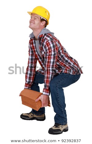 [[stock_photo]]: Tradesman Lifting A Heavy Load