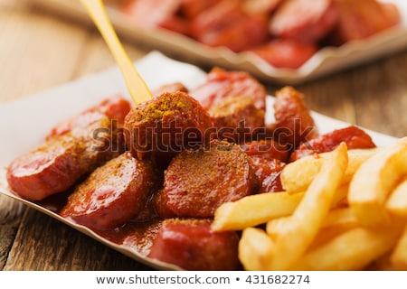 Stockfoto: Curry Wurst Spicy Sausage With Curry And Ketchup