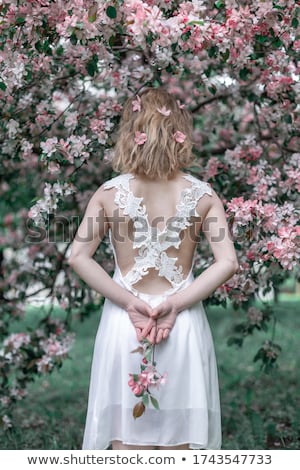 Stock fotó: Happy Blonde Girl With Flowers