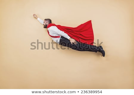 Foto stock: Super Hero Wearing Red Cloak On White
