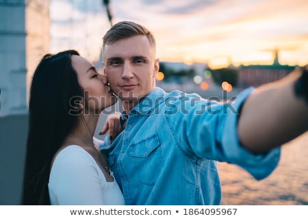 Foto stock: Couple Closehugging During Sunset