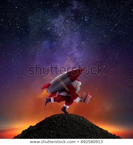 Stockfoto: Fast Delivery Of Christmas Gifts Ready To Fly With A Rocket