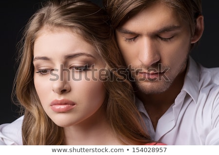ストックフォト: Pensive Young Couple Standing Isolated