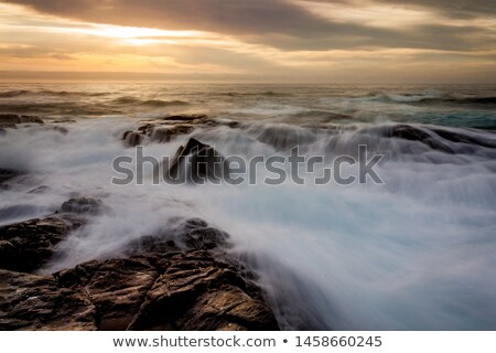 Сток-фото: Mystical Light Over The Ocean With Rocky Ocean Cascades
