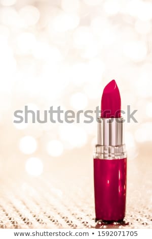 Сток-фото: Maroon Lipstick On Golden Christmas New Years And Valentines Da