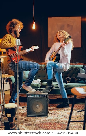 Stock photo: Young Woman Playing The Electric Guitar