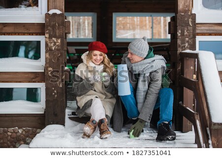 Stockfoto: Couple Sat On Porch