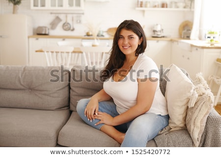 Foto stock: Cute Smiling Relaxing Plump Woman