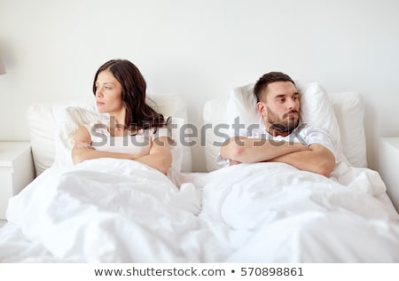 Stock fotó: Unhappy Couple Having Argument At Bedroom