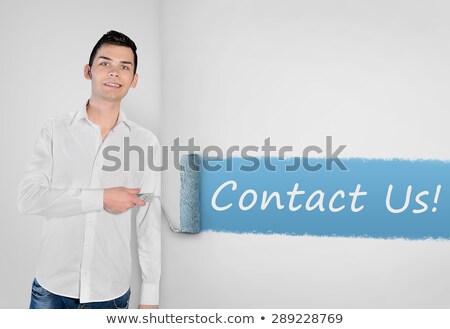 Stock fotó: Man Painting Contact Us Word On Wall