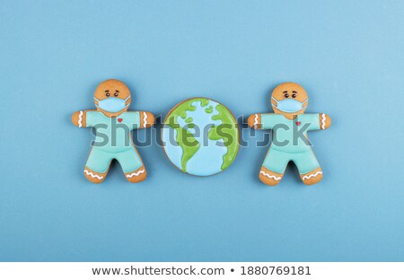 Stock fotó: Two Gingerbread Man On Blue Background