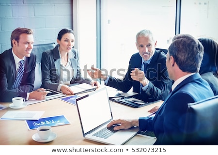 Stock fotó: Businesspeople In Conference Room During A Meeting In Office