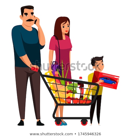 Stockfoto: A Boy Buys Toy Vegetables In A Toy Supermarket