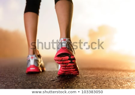 Stockfoto: Closeup On Running Shoes Of Woman On The Running Road