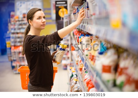 Stockfoto: Young Woman Shopping For Cereal Bulk In A Grocery Supermarket