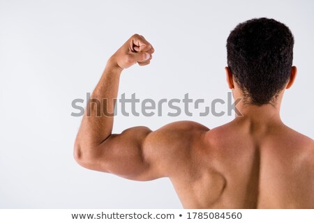 ストックフォト: Handsome African Man Showing His Muscles Over White Background
