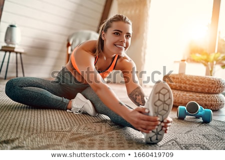 Foto d'archivio: Young Woman Doing Exercises In Gym Health Concept