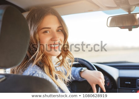 Foto stock: Young Caucasian Woman Driving Car