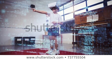 Zdjęcia stock: Boy Wearing Virtual Reality Simulator Dancing At Home