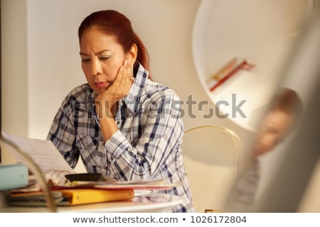 Foto stock: Angry Senior Woman Paying Bills And Filing Federal Tax Return