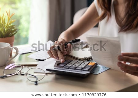 Foto stock: Calculating The Expenses