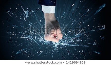 [[stock_photo]]: Hand Hits Intense And Breaks Glasses