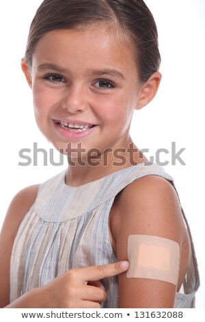 Foto stock: A Girl Wearing An Adhesive Bandage