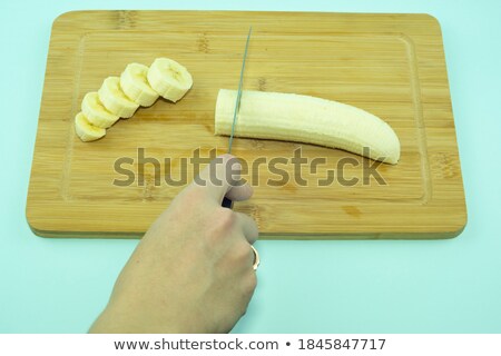 Foto stock: Bananas On Carving Board