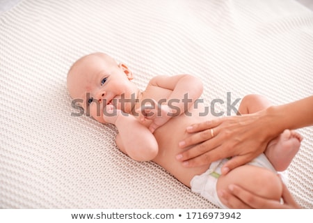 [[stock_photo]]: Baby Belly With Parents Hands