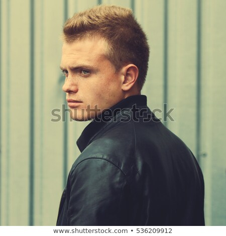 Portrait Of Attractive Man Wearing Leather Jacket Thinking Stock photo © Augustino