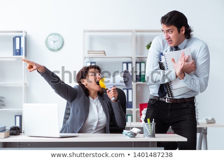 Stok fotoğraf: Old Female Boss And Young Male Employee In The Office