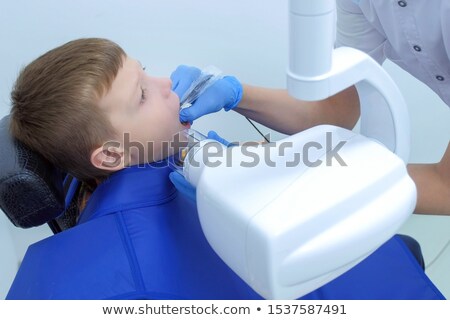 Stok fotoğraf: Dentist Making X Ray Of Kid Teeth At Dental Clinic