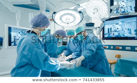 ストックフォト: Medical Doctors Performing Operation In Hospital