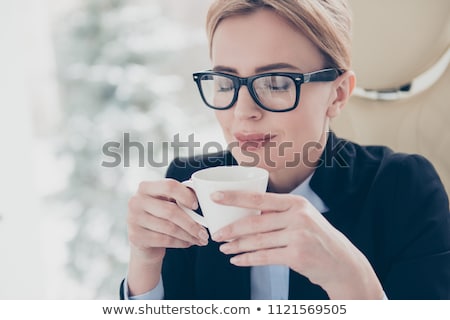 Stockfoto: Close Up Of A Beautiful Young Woman Drinking Coffee