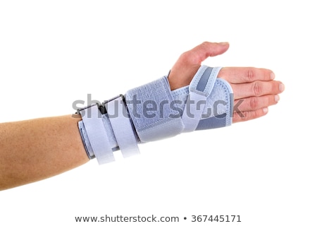 Stock fotó: Man Wearing Supportive Wrist Brace In Studio