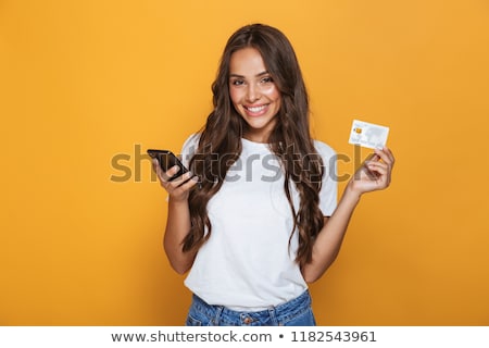 Foto stock: Portrait Of A Happy Young Girl With Long Brunette Hair
