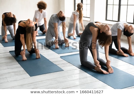 Stockfoto: Female Athlete Exercising On Fitness Mat