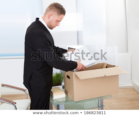 Stock fotó: Businessman Packing His Belongings In Cardboard Box