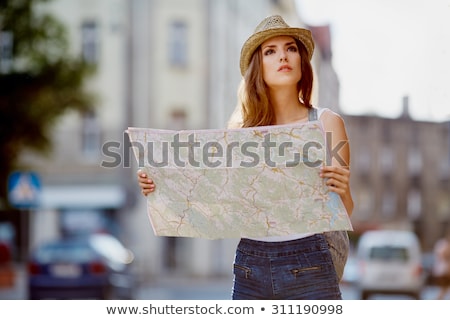 Stok fotoğraf: Women With Map And City Guide On Street In Summer
