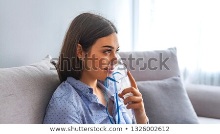 Foto stock: Woman With Flu Or Cold Symptoms Making Inhalation With Nebulizer - Medical Inhalation Therapy