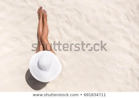 Сток-фото: Woman Tanning On The Beach
