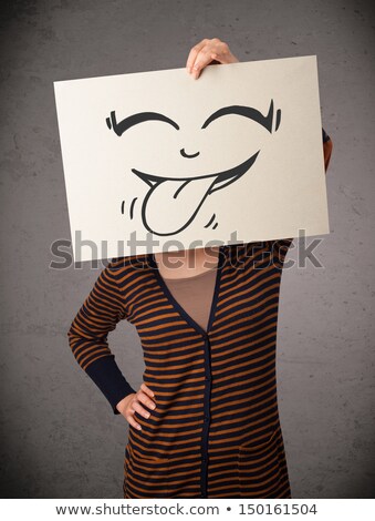 商業照片: Happy Cute Girl Holding Paper With Funny Smiley Drawing