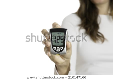 Stockfoto: Hand Holding Glucometer