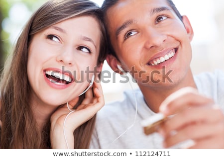 Сток-фото: Teenage Couple Listening To An Mp3 Player