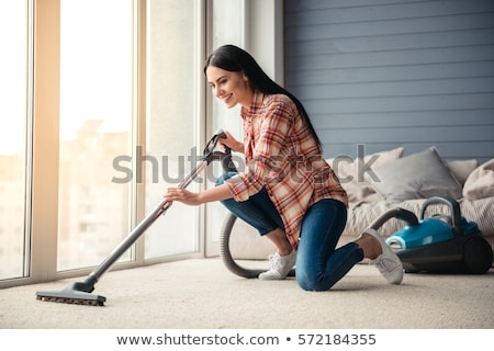 Stockfoto: Person Using Vacuum Cleaner For Cleaning Floor