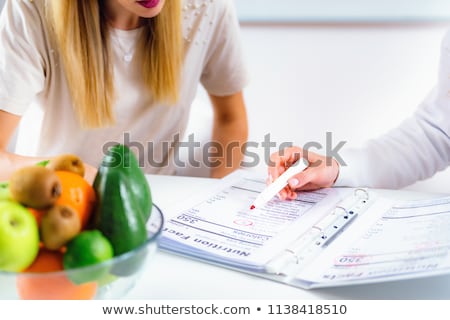 Stockfoto: Nutritionist Consult At The Office