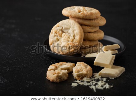 Stock fotó: White Chocolate Biscuit Cookies With Chocolate Blocks And Curls On White Background