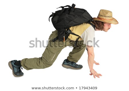 ストックフォト: Traveller With Backpack In Straw Hat On All Fours